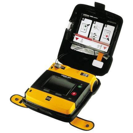 Hjärtstartare Lifepak 1000 med EKG öppen, inkluderar användarmanual och tydliga bruksanvisningar.